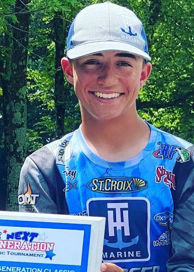 Trey McKinney posing with his USA Bassin Next Generation Award plaque.